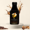 Cohoma Cinnamon Hazelnut Cold Brew Coffee bottle front with splashing coffee, featuring ready-to-drink cold brew with a hint of Sri Lankan cinnamon and hazelnut.