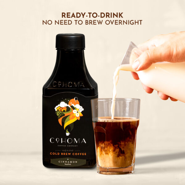 Cohoma Cinnamon Hazelnut Cold Brew Coffee with milk being poured into a glass, showcasing ready-to-drink cold brew without the need for overnight brewing.