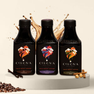 Cohoma Cold Brew Coffee trio featuring French Vanilla, Original, and Cinnamon flavors in ready-to-drink bottles.