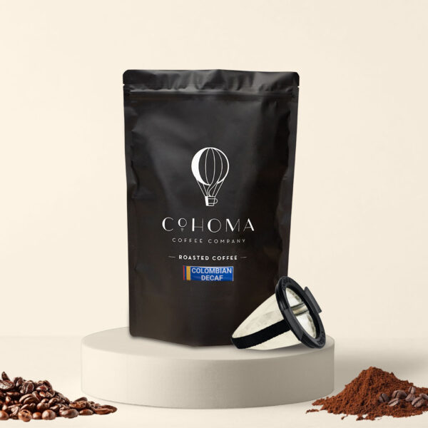 Cohoma Colombian Decaf Roasted Coffee pouch with free reusable Purebrew filter, featuring premium decaffeinated coffee.