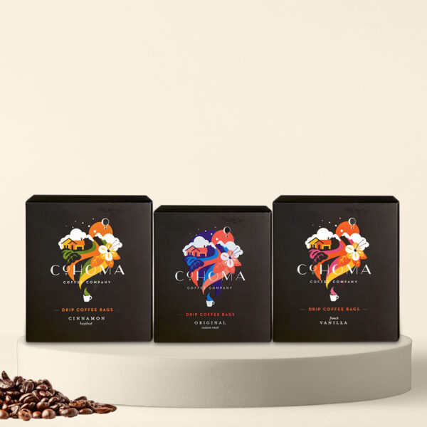 Cohoma Signature Flavour Trio Drip Coffee Bag with accompanying box, showcasing the vibrant packaging design with fresh coffee.