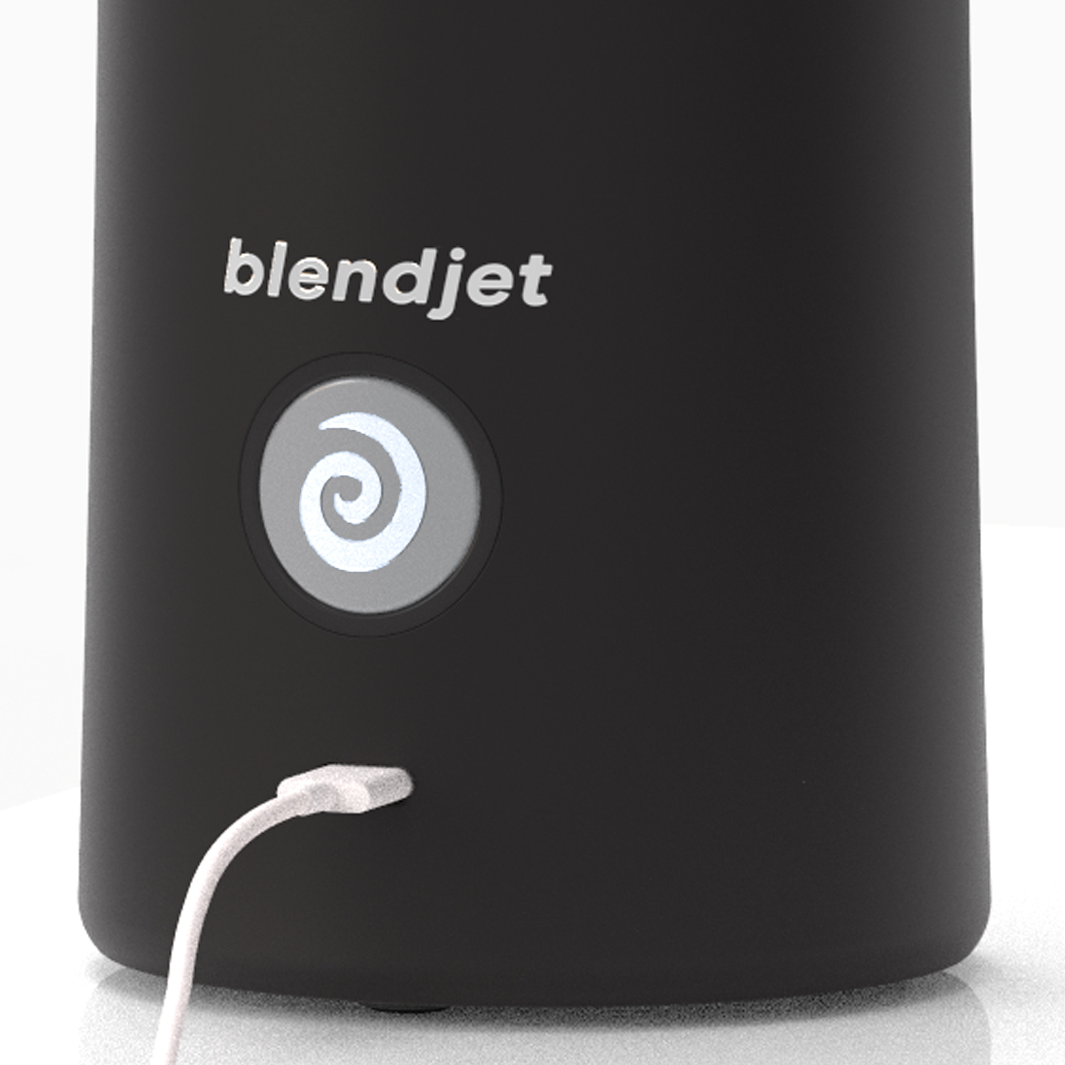 Close-up of the BlendJet 2 portable blender showing the USB charging port and power button with a sleek black design